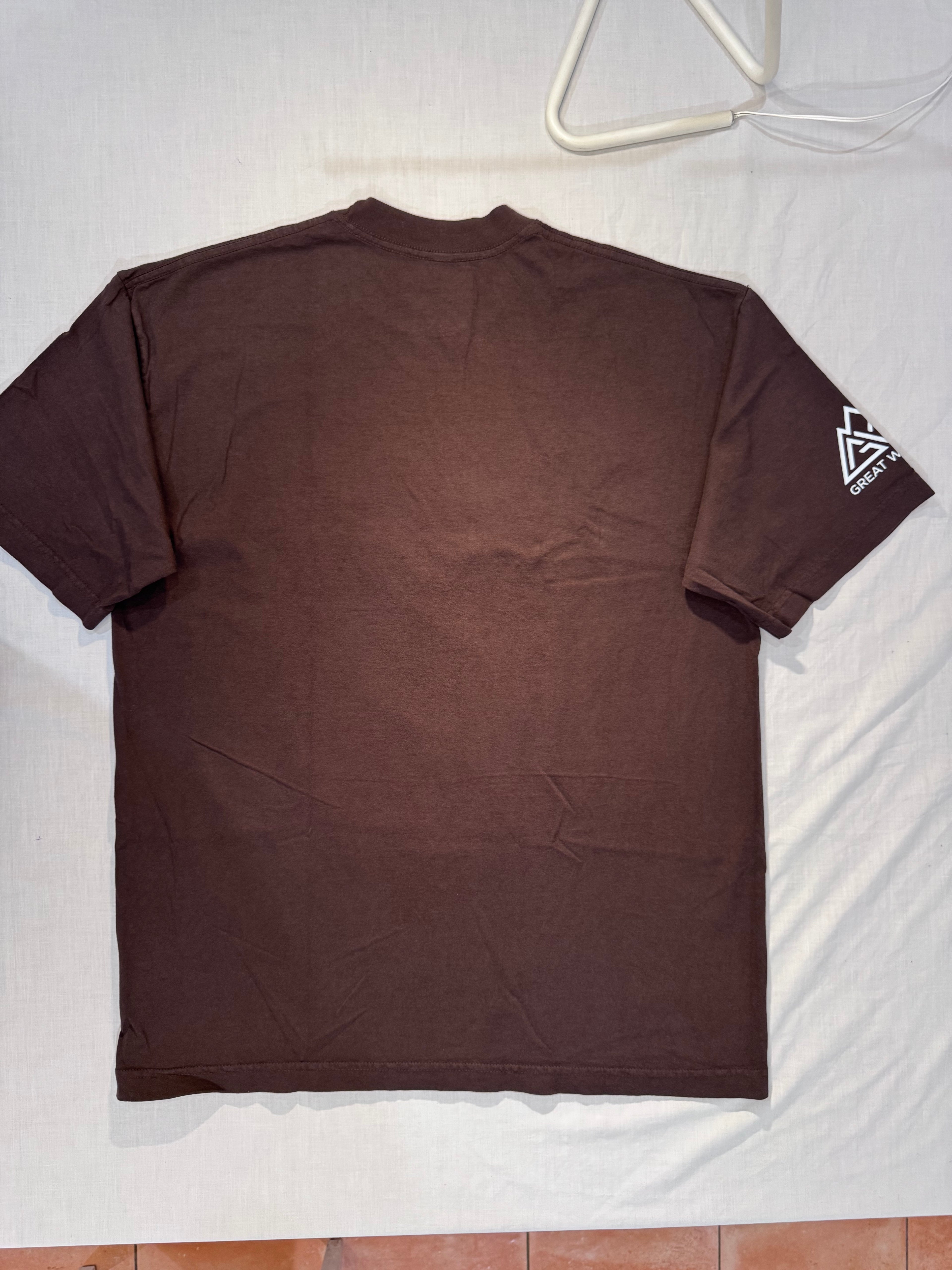 Brown t-shirt with a logo on a white surface